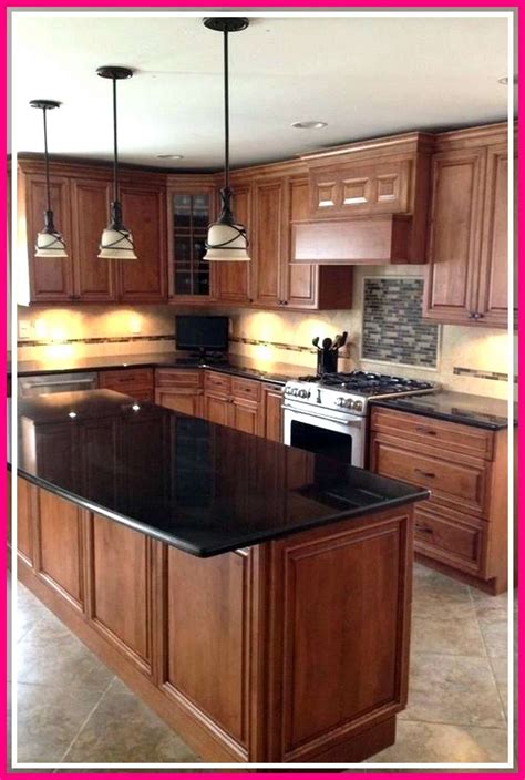 kitchen with oak cabinets and black stainless steel appliances|how to modernize oak cabinets.